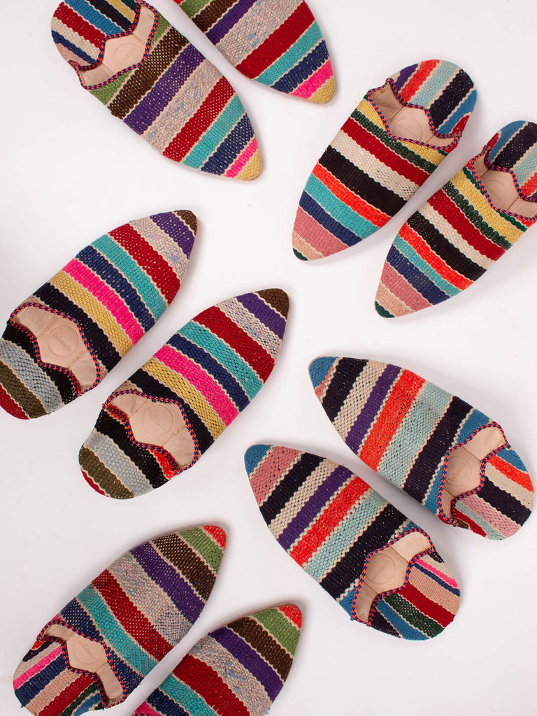 Group of Bohemia design boujad babouche slippers in multi stripe pattern