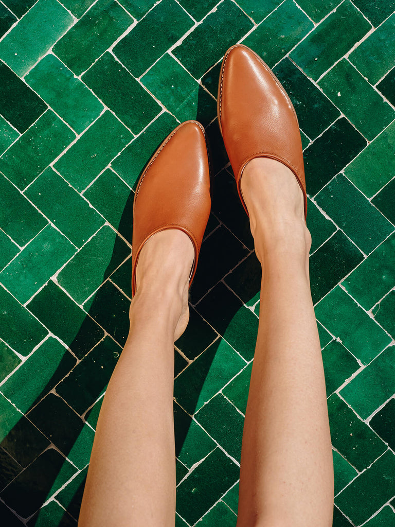 Bohemia-leather-mules-tan-against-green-Moroccan-tiles