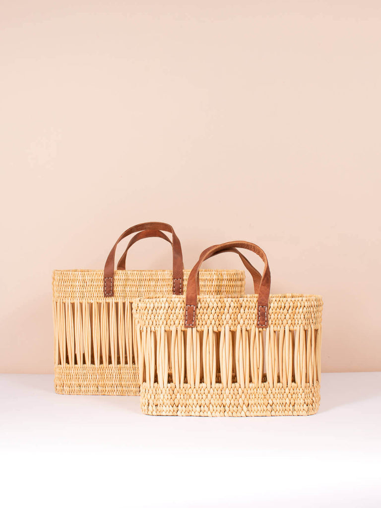 Two sizes of the Decoraive Reed Basket with leather handles