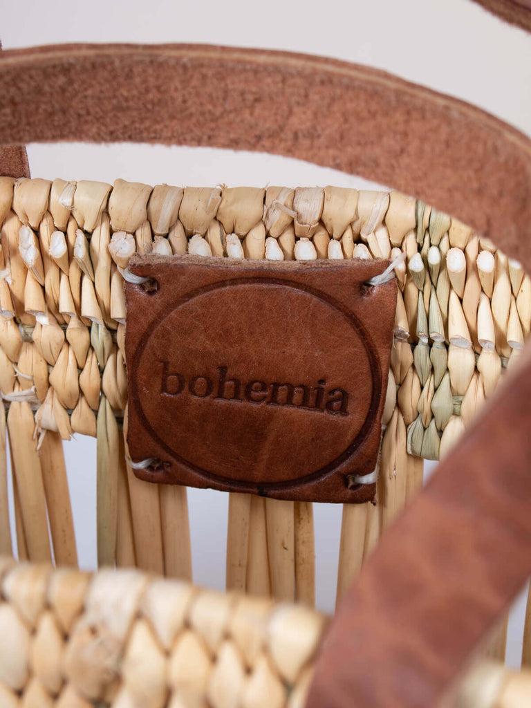 Branded Bohemia leather hand stamped label inside the decorative reed basket bag