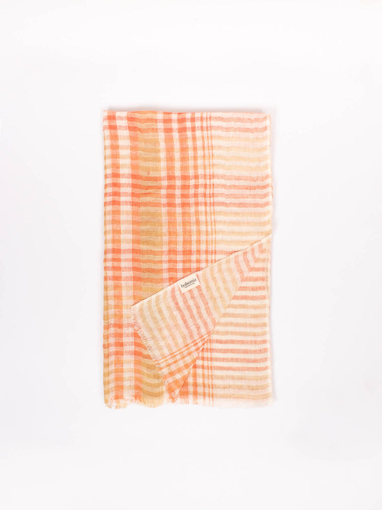 Checked linen scarf in mustard and orange folded showing the Bohemia Design label