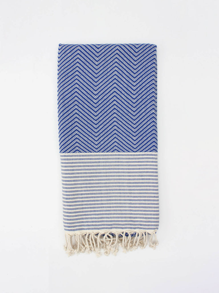 Malibu Hammam Towel folded to show zig zag stripe pattern in blue