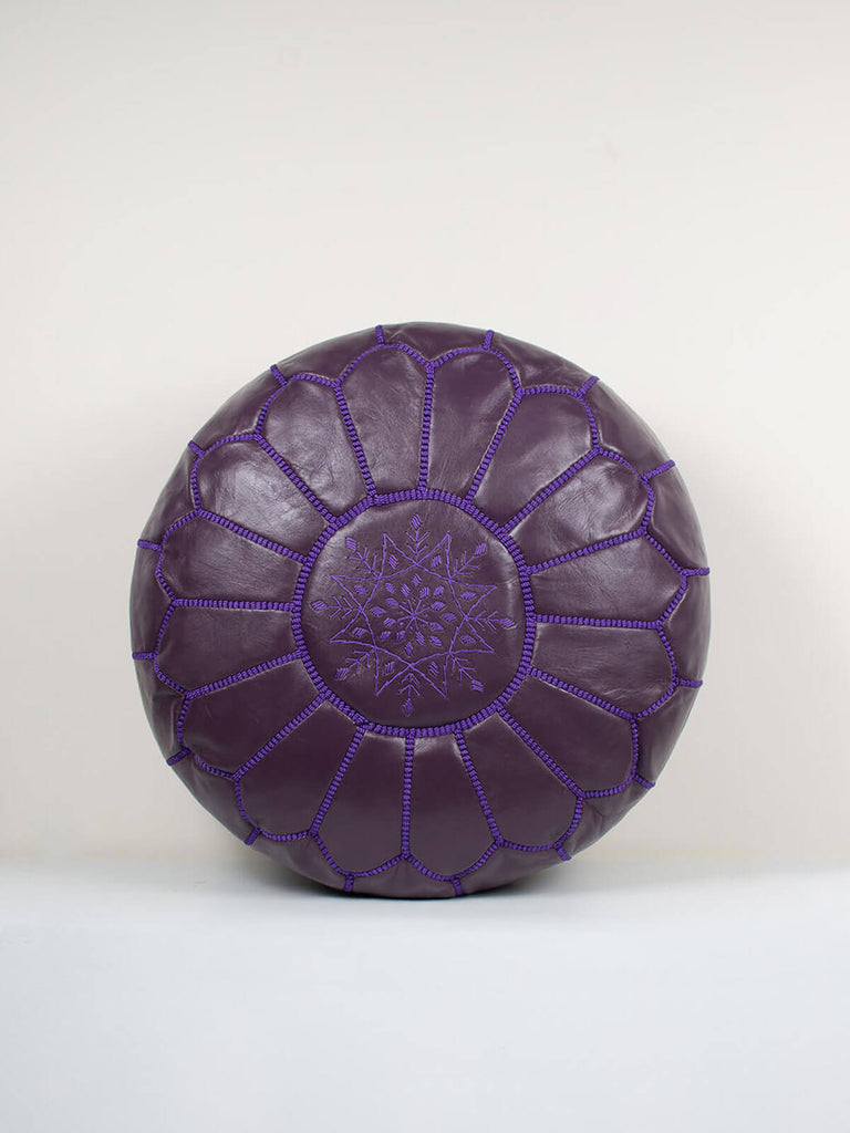 Purple Moroccan Leather Pouffe with purple stitching and embroidered top
