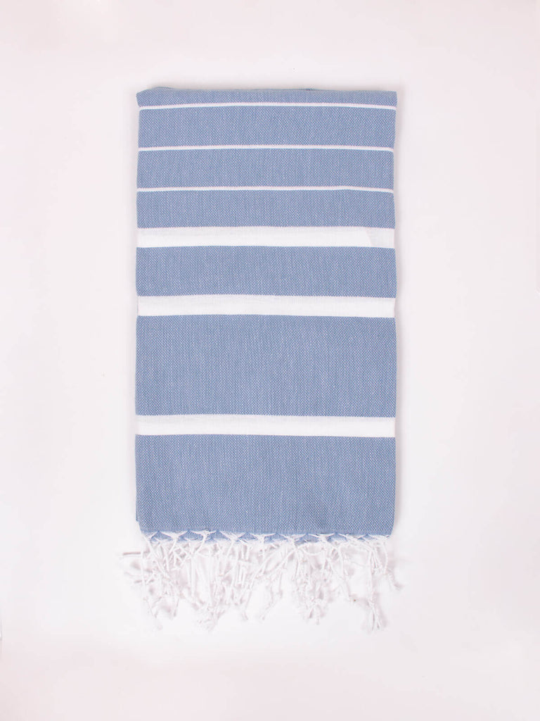 Soft blue cotton hammam towel with white striped pattern and hand knotted tassels