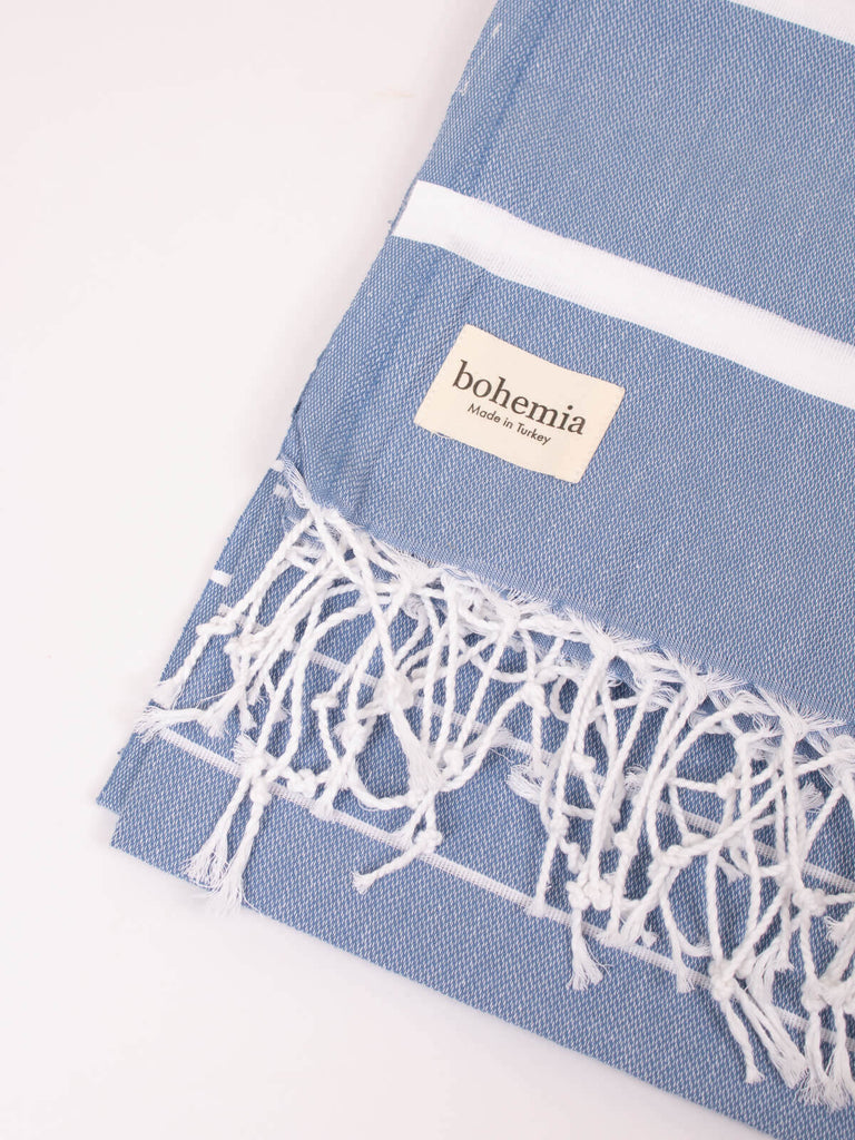Close up of the powder blue and white striped Ibiza hammam towel