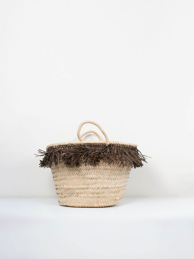 A small Raffia Tassel basket with playful moss coloured tassels