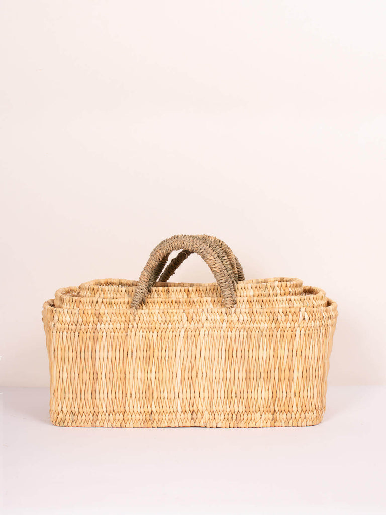 Natural handwoven reed wicker storage baskets in three nesting sizes