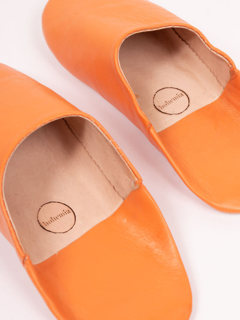 Close up of the soft leather inner on a pair of clementine orange Moroccan babouche slippers