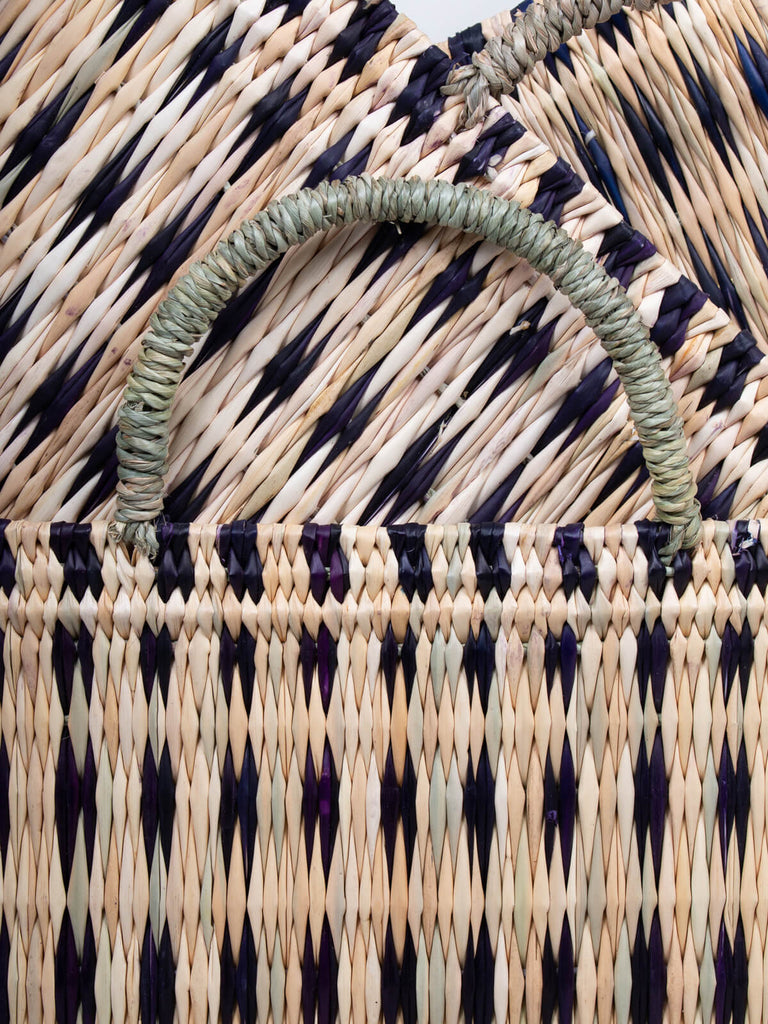 Woven reed basket handmade using natural reed with short sisal handles