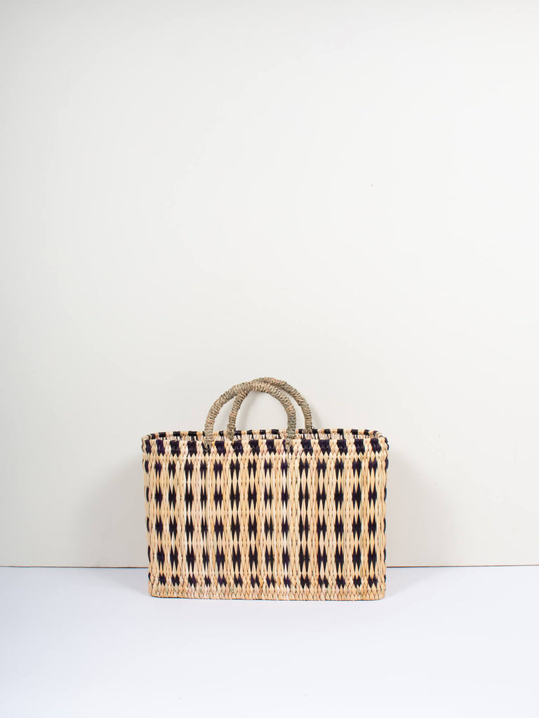 Medium natural woven reed tote basket bag with short handles and  and skillfully weaved indigo pattern by Bohemia Design