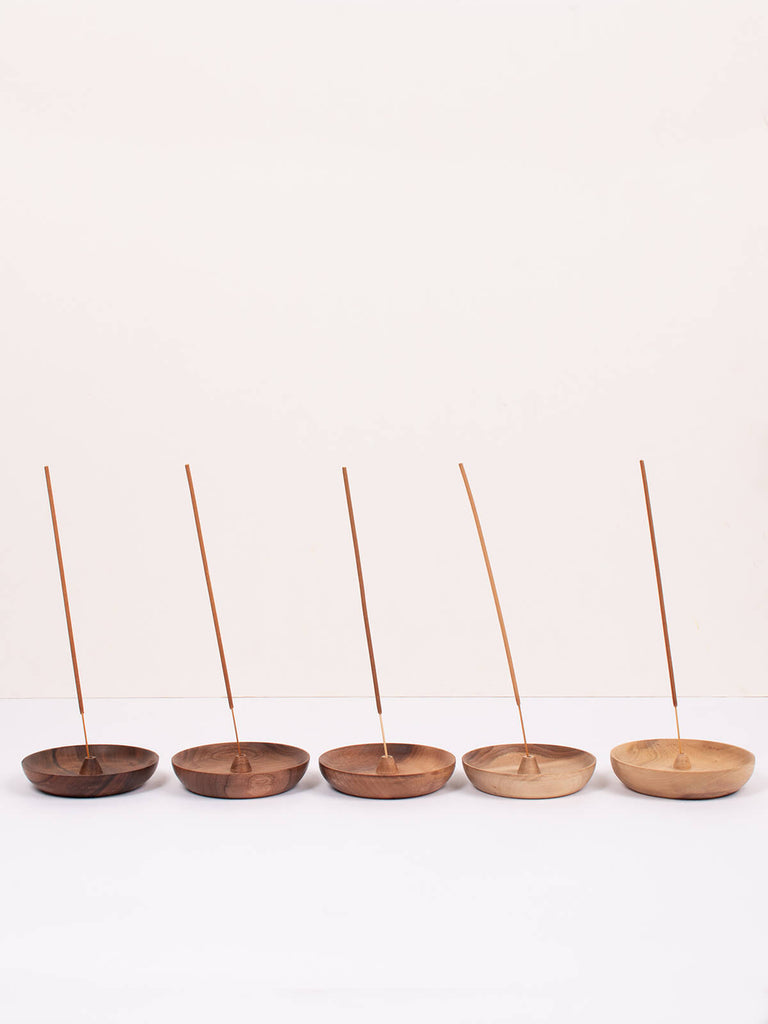 A row of 5 Walnut wood round incense holders by Bohemia Design