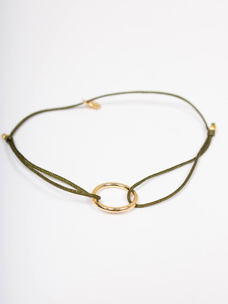 Gold juno bracelet with olive silk thread