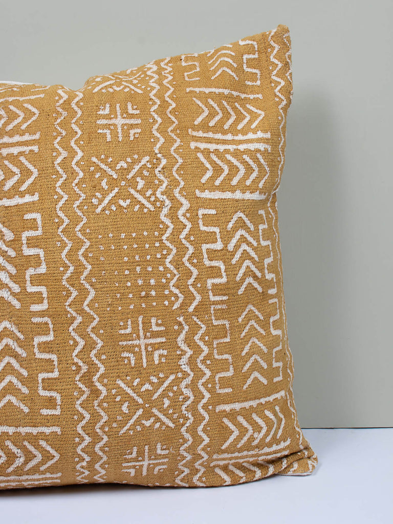 Saffron coloured cushion with mudcloth patterns by Bohemia Design
