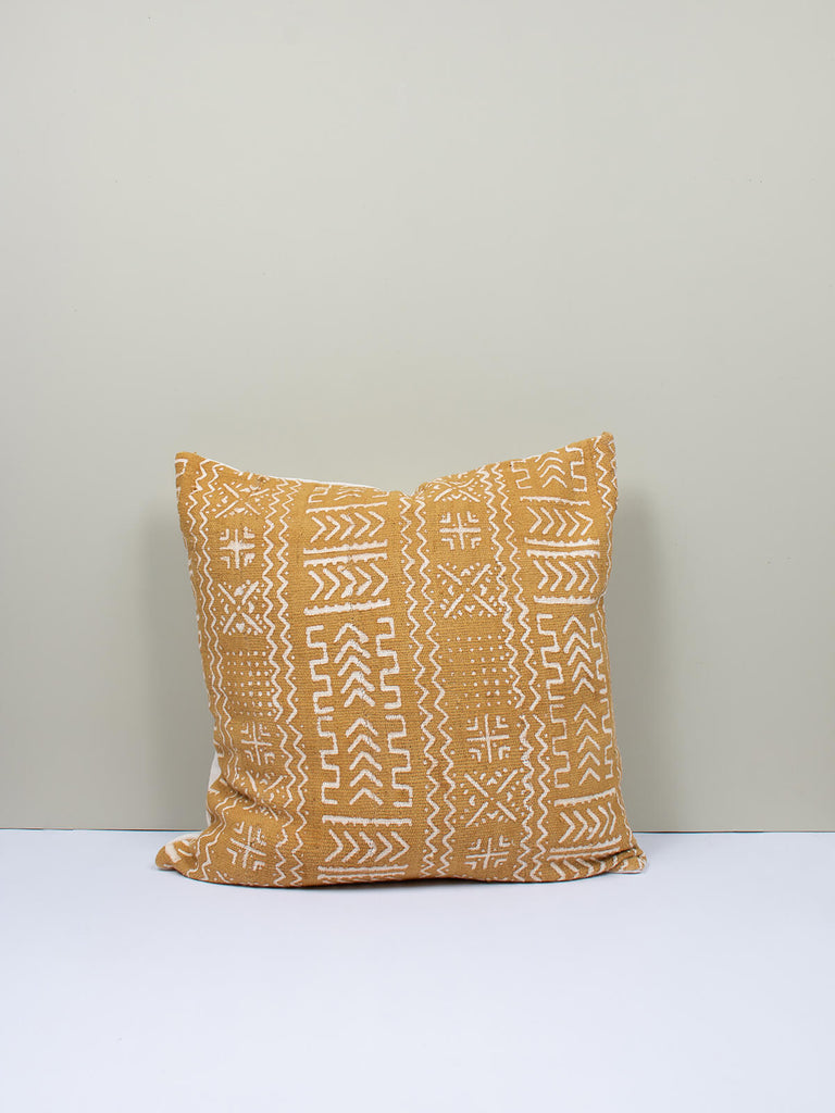 Saffron coloured cushion with mudcloth patterns by Bohemia Design