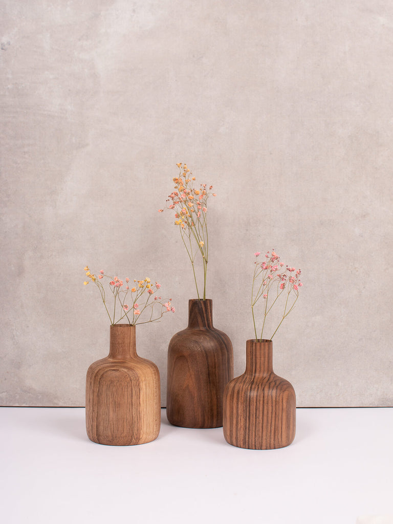 Set of three mini walnut wood vases with pink dried flowers by Bohemia Design
