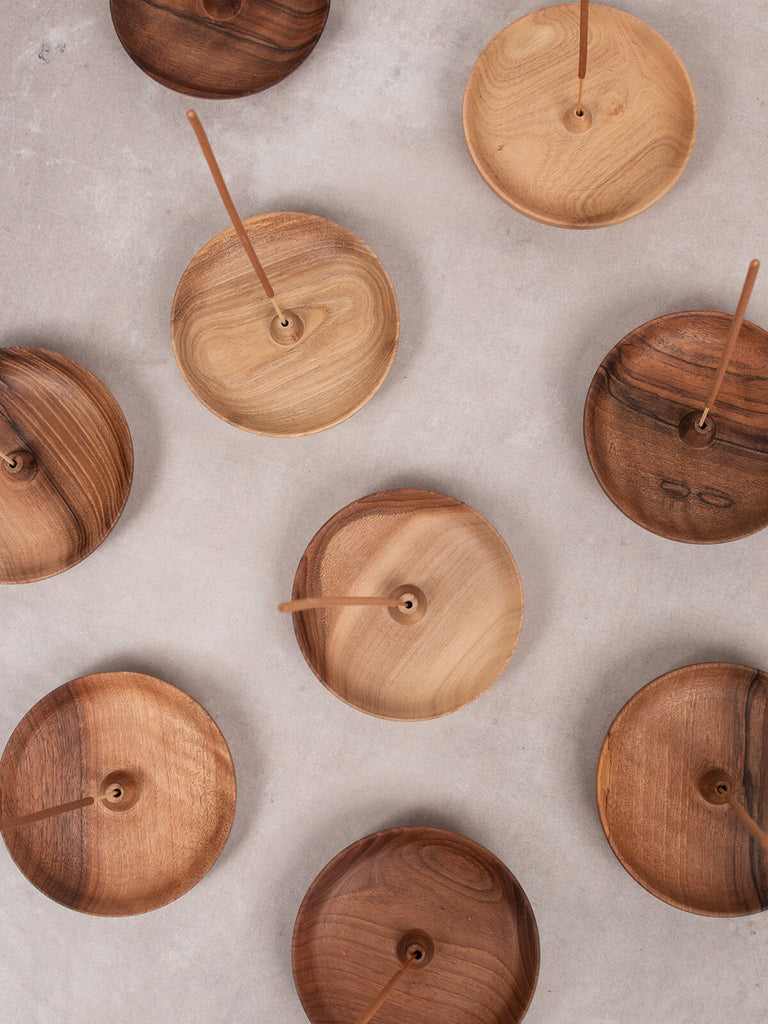 A group of Walnut wood round incense holders by Bohemia Design