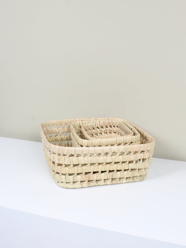 Three nesting hand woven basket trays for natural storage around the home